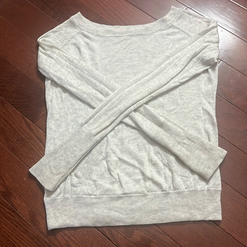 Light weight modal sweater. Oatmeal color. Front pocket & thumb holes on sleeves
